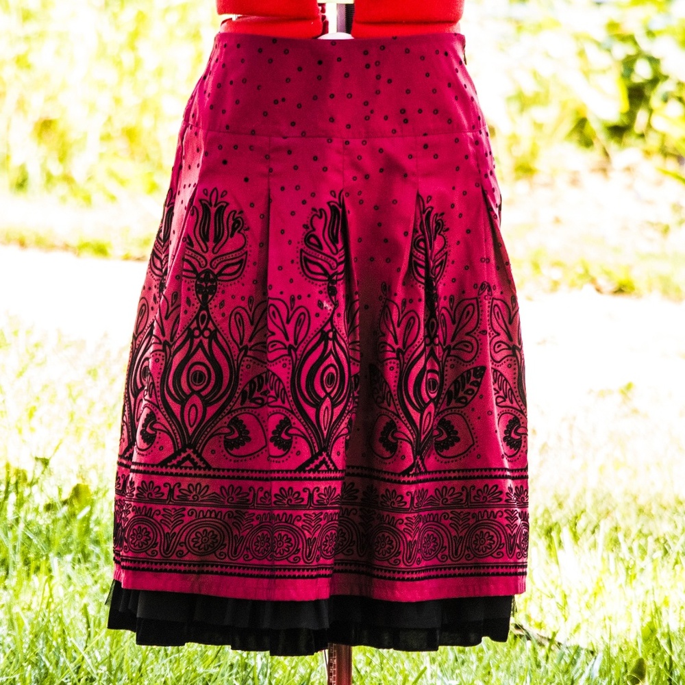 Red mid length skirt with black velvet detail